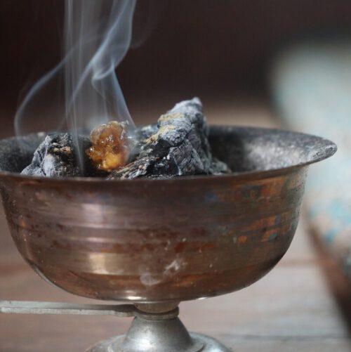 close up photo of gray round bowl with fire